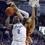 
              TCU forward Emanuel Miller (2) puts up a shot against Iowa State forward Robert Jones (12) during the second half of an NCAA basketball game Tuesday, Feb. 15, 2022, in Fort Worth, Texas. (AP Photo/Richard W. Rodriguez)
            