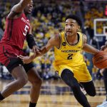 
              Michigan guard Kobe Bufkin (2) drives as Rutgers forward Aundre Hyatt (5) defends during the second half of an NCAA college basketball game, Wednesday, Feb. 23, 2022, in Ann Arbor, Mich. (AP Photo/Carlos Osorio)
            