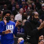 
              James Harden claps from the bench during the first half of an NBA basketball game against the Milwaukee Bucks Thursday, Feb. 17, 2022, in Milwaukee. (AP Photo/Morry Gash)
            