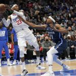 
              Los Angeles Clippers forward Robert Covington (23) looks to pass the ball against Dallas Mavericks guard Theo Pinson (21) during the first quarter of an NBA basketball game in Dallas, Saturday, Feb. 12, 2022. (AP Photo/LM Otero)
            
