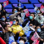 
              Spectators cheer during a preliminary round men's hockey game between China and Canada at the 2022 Winter Olympics, Sunday, Feb. 13, 2022, in Beijing. (AP Photo/Matt Slocum)
            