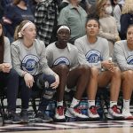 
              From the left, Connecticut's Caroline Ducharme, Paige Bueckers, Piath Gabriel, Olivia Nelson-Ododa, and Amari DeBerry sit on the bench in the second half of an NCAA college basketball game against Villanova, Wednesday, Feb. 9, 2022, in Hartford, Conn. Three starters, Ducharme, Bueckers, and Nelson-Ododa did not play for UConn. (AP Photo/Jessica Hill)
            