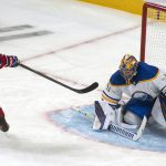 
              Montreal Canadiens center Nick Suzuki (14) scores on Buffalo Sabres goalie Craig Anderson on a penalty shot during the second period of an NHL hockey game Wednesday, Feb. 23, 2022, in Montreal. (Peter McCabe/The Canadian Press via AP)
            