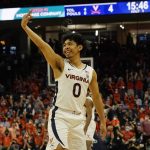 
              Virginia guard Kihei Clark (0) celebrates a three point shot during the first half of an NCAA college basketball game against Duke Wednesday Feb. 23, 2022, in Charlottesville, Va. (AP Photo/Steve Helber)
            