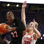 
              Louisville forward Liz Dixon (22) shoots over Clemson guard Madi Ott (30) in the first half of an NCAA college basketball game in Clemson, N.C., Thursday, Feb. 3, 2022. (AP Photo/Nell Redmond)
            