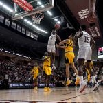 
              Texas A&M guard Quenton Jackson (3) dunks the ball over Missouri forward Trevon Brazile (23) during the second half of an NCAA college basketball game, Saturday, Feb. 5, 2022, in College Station, Texas. (AP Photo/Sam Craft)
            