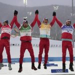 
              From left, Alexey Chervotkin, of the Russian Olympic Committee, Alexander Bolshunov, Denis Spitsov, and Sergey Ustiugov celebrate a gold medal finish during a venue ceremony after the men's 4 x 10km relay cross-country skiing competition at the 2022 Winter Olympics, Sunday, Feb. 13, 2022, in Zhangjiakou, China. (AP Photo/Alessandra Tarantino)
            
