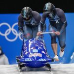 
              Frank Delduca and Hakeem Abdul-Saboor, of United States, start the 2-man heat 1 at the 2022 Winter Olympics, Monday, Feb. 14, 2022, in the Yanqing district of Beijing. (AP Photo/Pavel Golovkin)
            