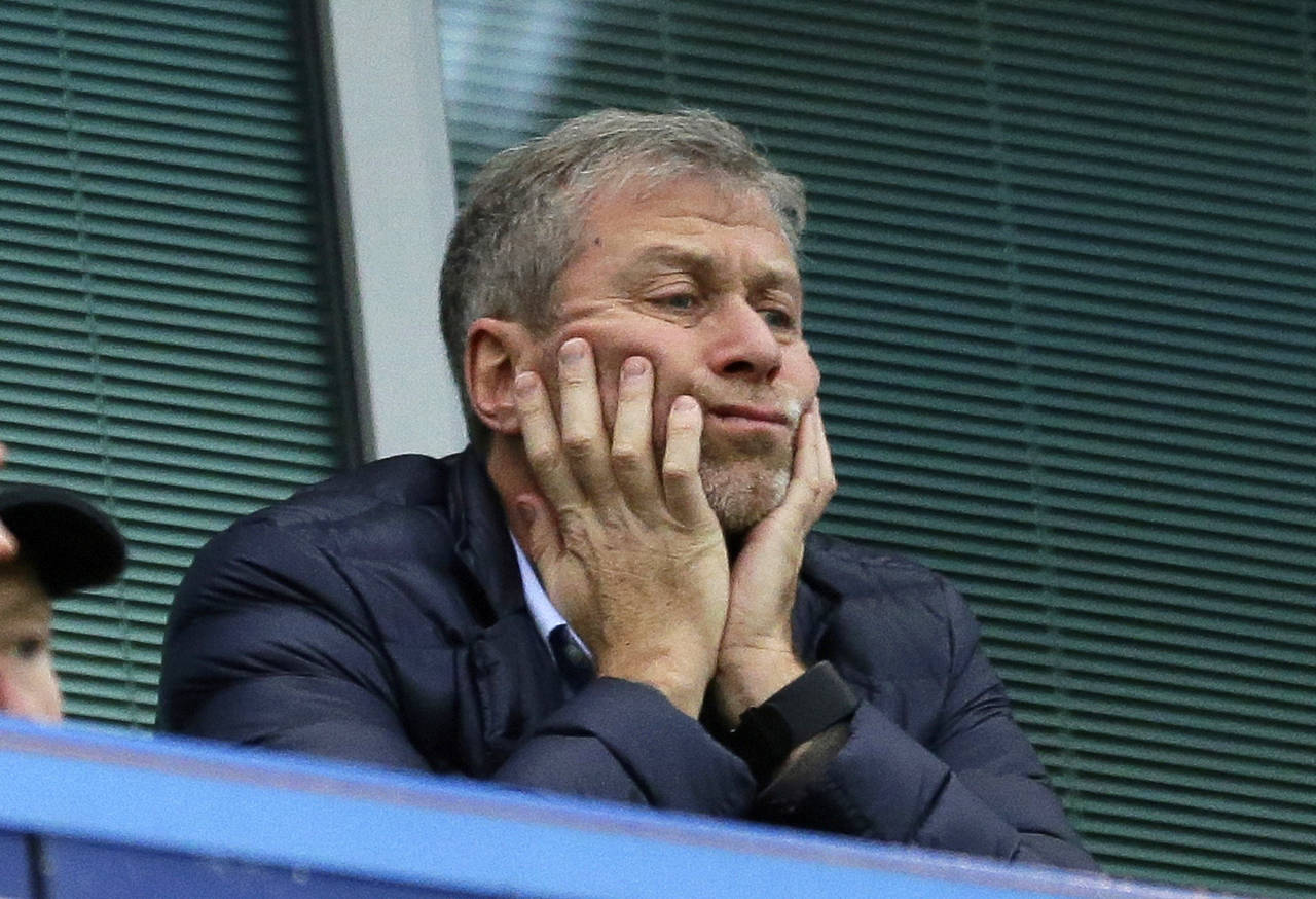 FILE - Chelsea soccer club owner Roman Abramovich sits in his box before their English Premier Leag...