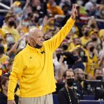 
              Michigan interim head coach Phil Martelli signals from the sideline during the second half of an NCAA college basketball game against Rutgers, Wednesday, Feb. 23, 2022, in Ann Arbor, Mich. (AP Photo/Carlos Osorio)
            