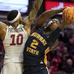 
              Murray State's Trae Hannibal (2) heads to the basket as Southeast Missouri State's Manny Patterson (10) defends during the first half of an NCAA college basketball game Saturday, Feb. 26, 2022, in Cape Girardeau, Mo. (AP Photo/Jeff Roberson)
            
