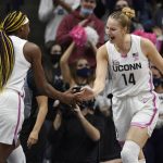 
              Connecticut's Aaliyah Edwards, left, and Dorka Juhász slap hands during the first half of the team's NCAA college basketball game against DePaul, Friday, Feb. 11, 2022, in Storrs, Conn. (AP Photo/Jessica Hill)
            