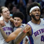 
              Detroit Pistons forward Saddiq Bey celebrates a game winning basket by forward Kelly Olynyk during overtime in an NBA basketball game against the Charlotte Hornets on Sunday, Feb. 27, 2022, in Charlotte, N.C. (AP Photo/Chris Carlson)
            