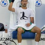 
              Serbia's Novak Djokovic reacts during his training a day ahead of the Dubai Duty Free Tennis Championship in Dubai, United Arab Emirates, Sunday, Feb. 20, 2022. (AP Photo/Kamran Jebreili)
            