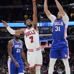 
              Philadelphia 76ers guard Seth Curry, right, shoots over Chicago Bulls forward Troy Brown Jr., during the first half of an NBA basketball game in Chicago, Sunday, Feb. 6, 2022. (AP Photo/Nam Y. Huh)
            