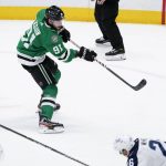 
              Dallas Stars center Tyler Seguin (91) follows through on his overtime goal in an NHL hockey game against the Winnipeg Jets in Dallas, Wednesday, Feb. 23, 2022. (AP Photo/Tony Gutierrez)
            