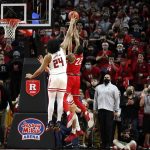 
              Rutgers guard Caleb McConnell (22) blocks the shot of Ohio State guard Malaki Branham (22) during the second half of an NCAA college basketball game in Piscataway, N.J., Wednesday, Feb. 9, 2022. Rutgers won 66-64. (AP Photo/Noah K. Murray)
            