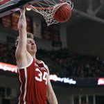 
              Oklahoma's Jacob Groves dunks during the first half of the team's NCAA college basketball game against Texas Tech, Tuesday, Feb. 22, 2022, in Lubbock, Texas. (AP Photo/Brad Tollefson)
            