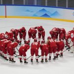 
              Russian Olympic Committee gather after losing a women's quarterfinal hockey game to Switzerland at the 2022 Winter Olympics, Saturday, Feb. 12, 2022, in Beijing. (AP Photo/Petr David Josek)
            