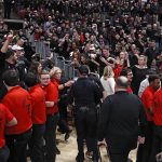 
              Texas Tech fans yell at Texas coach Chris Beard as he walks off the court after an NCAA college basketball game  Tuesday, Feb. 1, 2022, in Lubbock, Texas. (AP Photo/Brad Tollefson)
            