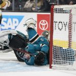 
              San Jose Sharks center Lane Pederson, foregound, and goaltender James Reimer crash into the net during the second period of an NHL hockey game against the Vegas Golden Knights in San Jose, Calif., Sunday, Feb. 20, 2022. (AP Photo/Jeff Chiu)
            