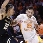 
              Tennessee guard Santiago Vescovi (25) drives against Vanderbilt forward Myles Stute (10) during the first half of an NCAA college basketball game Saturday, Feb. 12, 2022, in Knoxville, Tenn. (AP Photo/Wade Payne)
            
