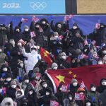 
              Spectators cheer as they wait for the women's slopestyle finals at the 2022 Winter Olympics, Tuesday, Feb. 15, 2022, in Zhangjiakou, China. (AP Photo/Lee Jin-man)
            
