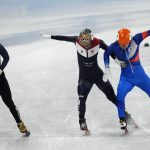 
              South Korea, left, crosses the finish line ahead of the Russian Olympic Committee, and the Netherlands, right, in their men's 5000-meters relay semifinal during the short track speedskating competition at the 2022 Winter Olympics, Friday, Feb. 11, 2022, in Beijing. (AP Photo/Bernat Armangue)
            