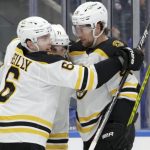 
              Boston Bruins left wing Taylor Hall (71) celebrates his goal with defensemen Mike Reilly (6) and Brandon Carlo during the first period of an NHL hockey game Thursday Feb. 17, 2022, in Elmont, N.Y. (AP Photo/Corey Sipkin).
            