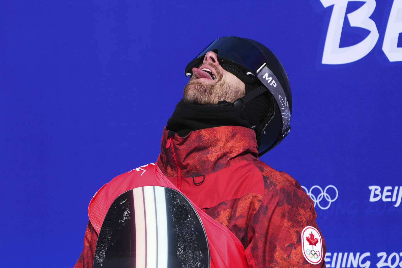 Canada's Max Parrot reacts after getting the high score following his second run in the men's slope...