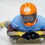 
              Tina Hermann, of Germany, finishes the women's skeleton run 2 at the 2022 Winter Olympics, Friday, Feb. 11, 2022, in the Yanqing district of Beijing. (AP Photo/Mark Schiefelbein)
            
