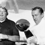 
              FILE - Oakland Raiders coach John Madden, left, and team owner Al Davis, holding the NFL football Super Bowl trophy, talk with media after beating the Minnesota  Vikings 32-14 in Pasadena, Calif., Jan. 9, 1977. For Davis' Raiders, the journey to the title was a long one. (AP Photo/Wally Fong, File)
            