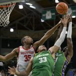 
              Houston forward Fabian White Jr. (35) jumps for a rebound against Tulane forwards Tylan Pope (33) and Kevin Cross during the first half of an NCAA college basketball game in New Orleans, Wednesday, Feb. 23, 2022. (AP Photo/Matthew Hinton)
            