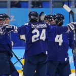 
              Finland players celebrate after an overtime win against Sweden in a preliminary round men's hockey game at the 2022 Winter Olympics, Sunday, Feb. 13, 2022, in Beijing. (AP Photo/Matt Slocum)
            