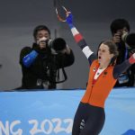 
              Ireen Wust of the Netherlands reacts after winning her heat and breaking an Olympic record in the women's speedskating 1,500-meter race at the 2022 Winter Olympics, Monday, Feb. 7, 2022, in Beijing. Her time stood for the gold medal. (AP Photo/Ashley Landis)
            