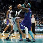 
              Charlotte Hornets Montrezl Harrell is fouled by Detroit Pistons forward Jerami Grant during the first half of an NBA basketball game on Sunday, Feb. 27, 2023, in Charlotte, N.C. (AP Photo/Chris Carlson)
            