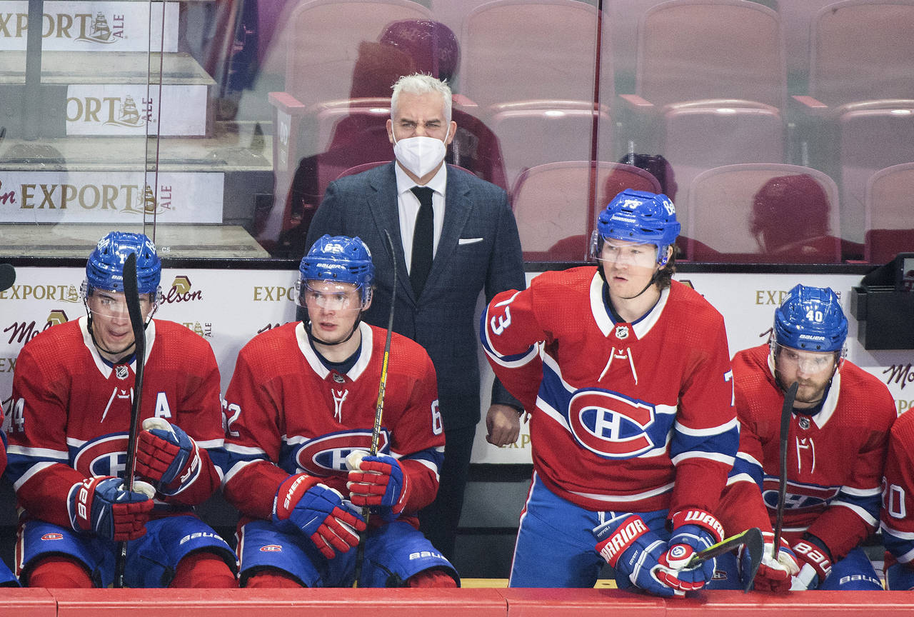 Montreal Canadiens head coach Dominique Ducharme looks on from behind the bench during an NHL hocke...