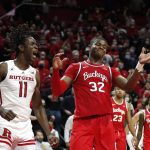
              Rutgers center Clifford Omoruyi (11) reacts after a dunk against Ohio State forward E.J. Liddell (32) during the second half of an NCAA college basketball game in Piscataway, N.J., Wednesday, Feb. 9, 2022. Rutgers won 66-64. (AP Photo/Noah K. Murray)
            