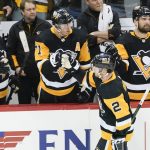 
              Pittsburgh Penguins' Chad Ruhwedel (2) is greeted by teammates on the bench after scoring against the Philadelphia Flyers during the third period of an NHL hockey game, Tuesday, Feb. 15, 2022, in Pittsburgh. The Penguins won 5-4 in overtime. (AP Photo/Keith Srakocic)
            