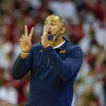 
              Michigan head coach Juwan Howard directs his team during the first half of an NCAA college basketball game against Wisconsin Sunday, Feb. 20, 2022, in Madison, Wis. Wisconsin won 77-63. (AP Photo/Andy Manis)
            