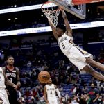 
              New Orleans Pelicans forward Herbert Jones dunks against the Houston Rockets during the second half of an NBA basketball game in New Orleans, Tuesday, Feb. 8, 2022. (AP Photo/Derick Hingle)
            
