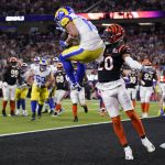 
              Los Angeles Rams wide receiver Cooper Kupp, top, catches a touchdown against Cincinnati Bengals cornerback Eli Apple during the second half of the NFL Super Bowl 56 football game Sunday, Feb. 13, 2022, in Inglewood, Calif. (AP Photo/Marcio Jose Sanchez)
            