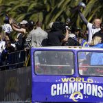 
              Los Angeles Rams offensive lineman Andrew Whitworth holds up the Vince Lombardi Super Bowl trophy during the team's victory parade in Los Angeles, Wednesday, Feb. 16, 2022, following their win Sunday over the Cincinnati Bengals in the NFL Super Bowl 56 football game. (AP Photo/Marcio Jose Sanchez)
            