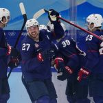 
              United States' Noah Cates (27) celebrates after scoring a goal against China during a preliminary round men's hockey game at the 2022 Winter Olympics, Thursday, Feb. 10, 2022, in Beijing. (AP Photo/Matt Slocum)
            
