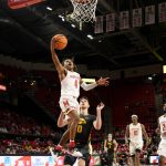 
              Maryland guard Fatts Russell (4) goes to the basket past Iowa forward Filip Rebraca (0) during the second half of an NCAA college basketball game Thursday, Feb. 10, 2022, in College Park, Md. (AP Photo/Nick Wass)
            