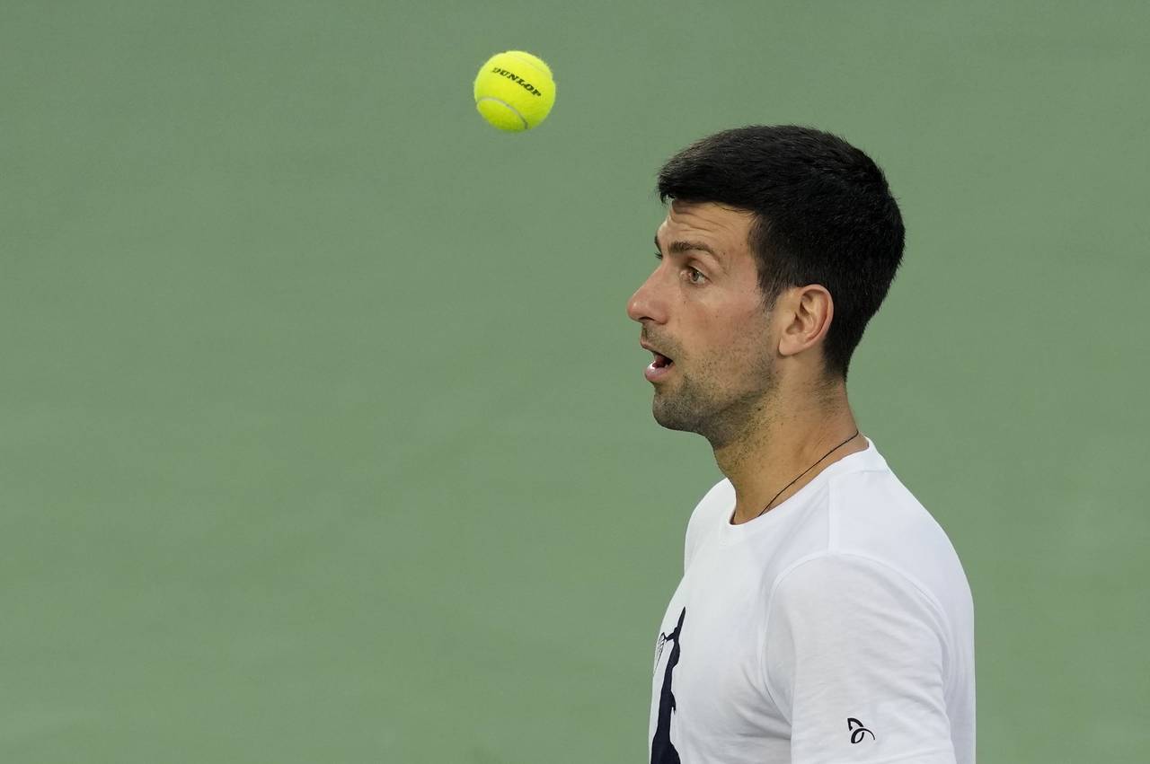 Serbia's Novak Djokovic trains a day ahead of the Dubai Duty Free Tennis Championship in Dubai, Uni...