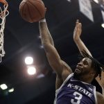 
              Kansas State guard Selton Miguel (3) shots under pressure from Kansas guard Christian Braun during the second half of an NCAA college basketball game Tuesday, Feb. 22, 2022, in Lawrence, Kan. Kansas won 102-83. (AP Photo/Charlie Riedel)
            