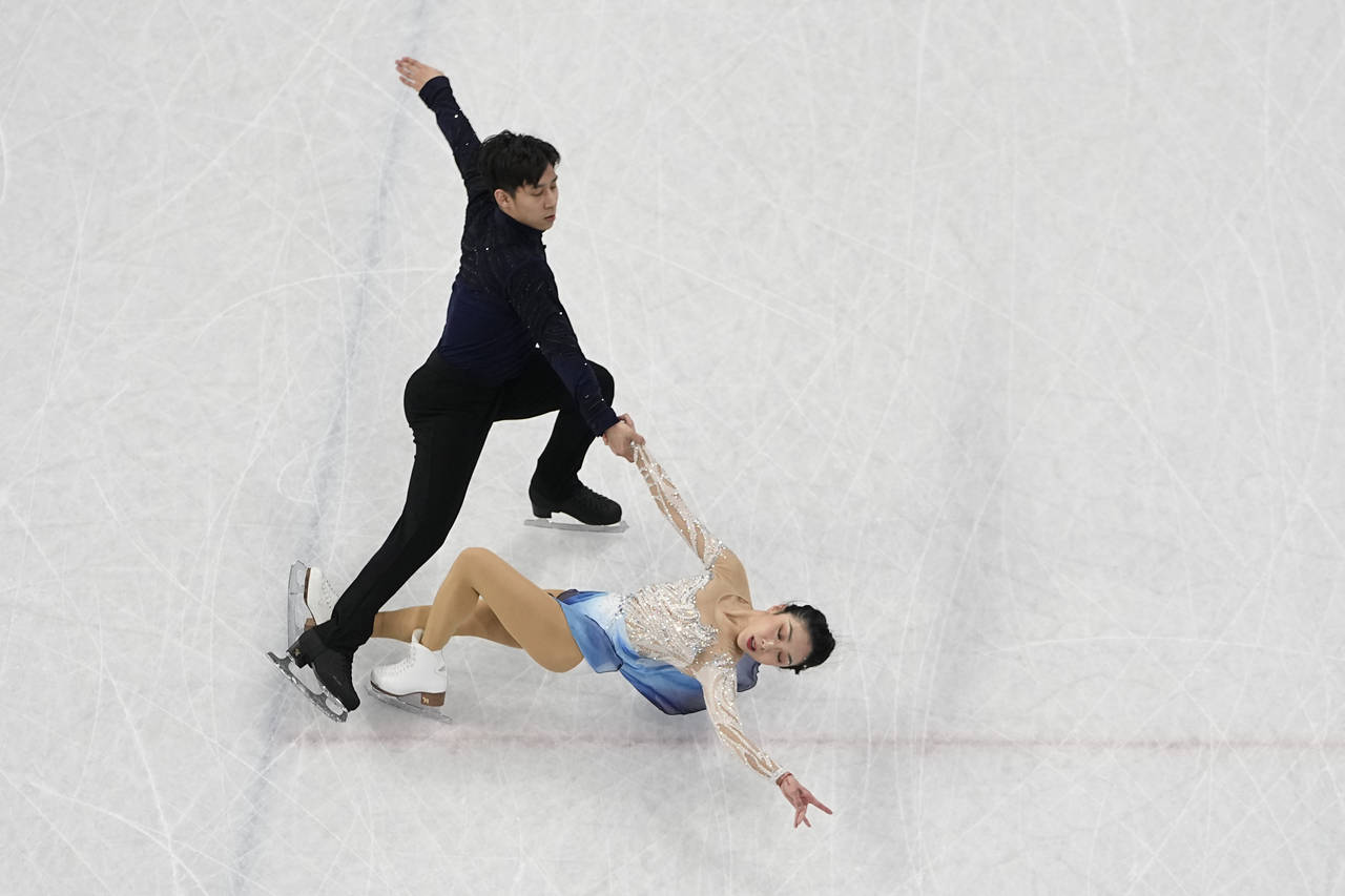 Sui Wenjing and Han Cong, of China, compete in the pairs free skate program during the figure skati...