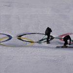
              Workers clear the Olympic rings on the ski jumping hill at the 2022 Winter Olympics, Tuesday, Feb. 15, 2022, in Zhangjiakou, China. (AP Photo/Alessandra Tarantino)
            