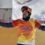 
              FILE - Nick Baumgartner, of the United States, celebrates after his run during the men's snowboard cross semifinals at Phoenix Snow Park at the 2018 Winter Olympics in Pyeongchang, South Korea, Feb. 15, 2018. On Thursday, Feb. 10, 2022, Baumgartner, 40, will kick off action at his fourth Olympics. (AP Photo/Gregory Bull, File)
            